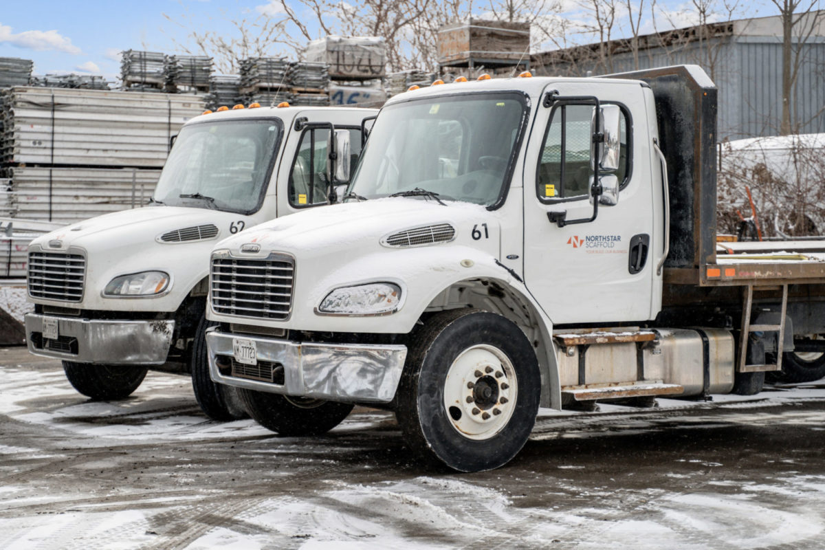 Two Northstar Access delivery trucks