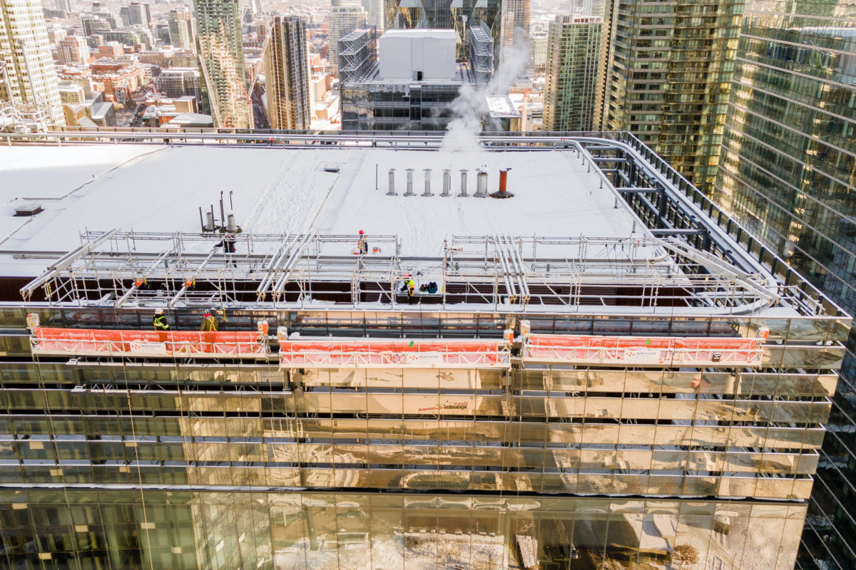 View of swing stages installed at top of high rise building